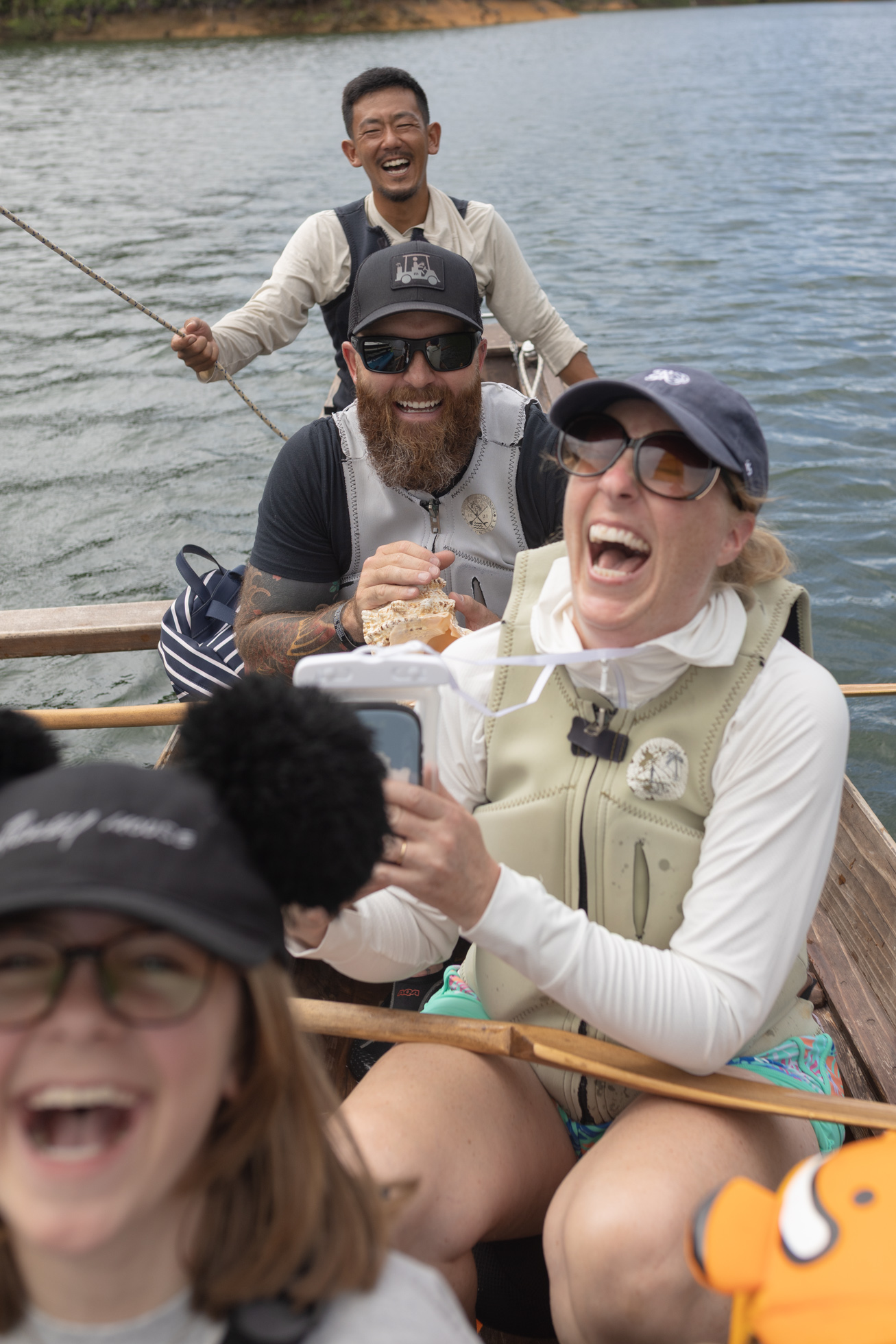 Guests and guides smiling aboard a sabani canoe